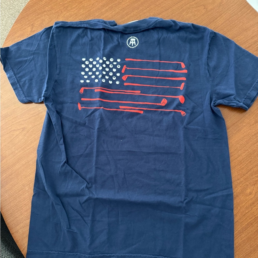 Barstool Golf T-Shirt with Red Golf Club Flag Design